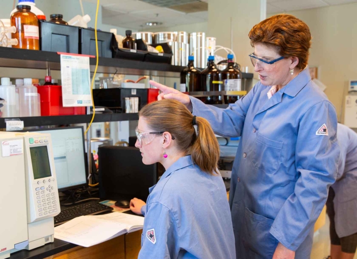 Student and professor in a science lab