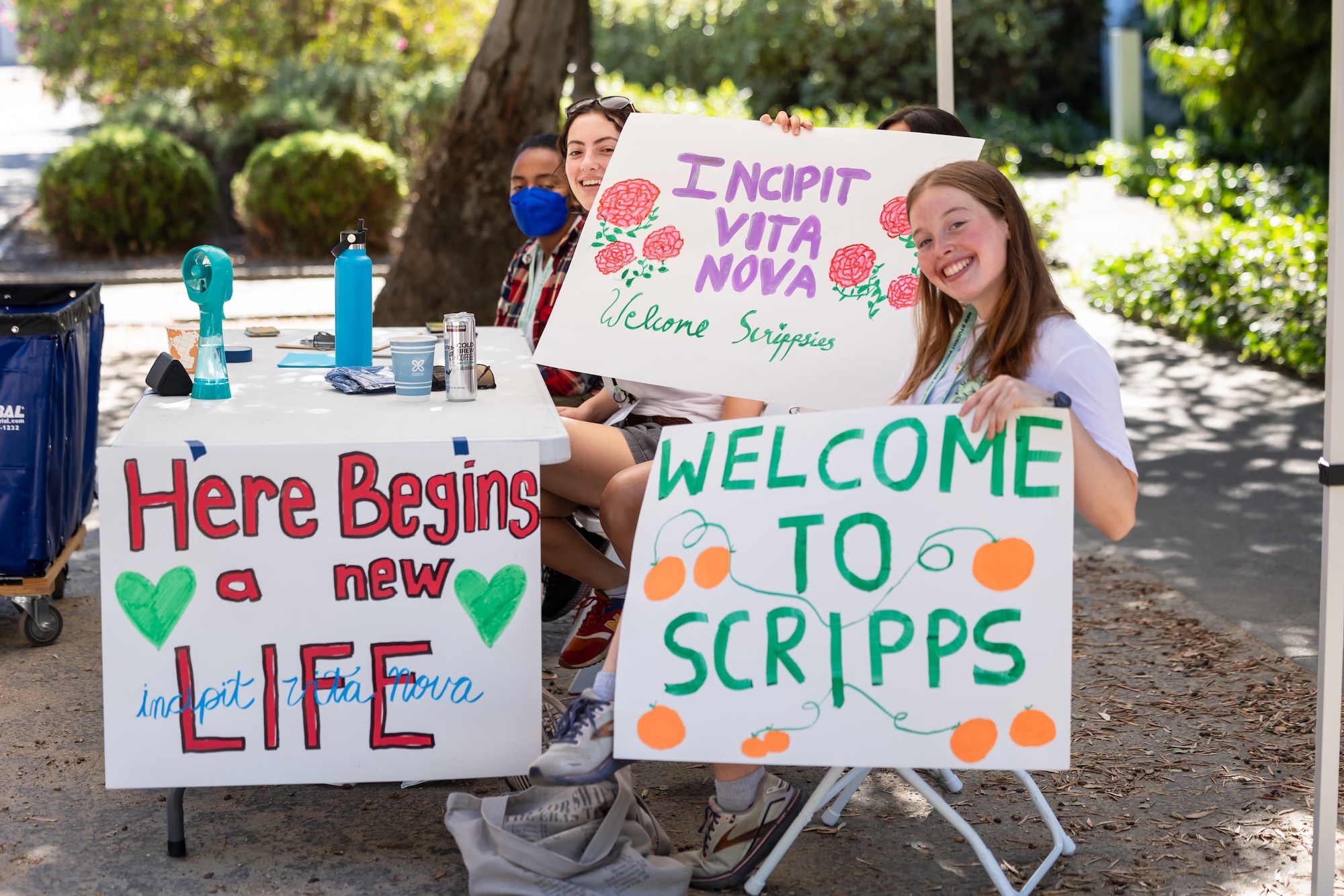 Scripps students holding signs reading 