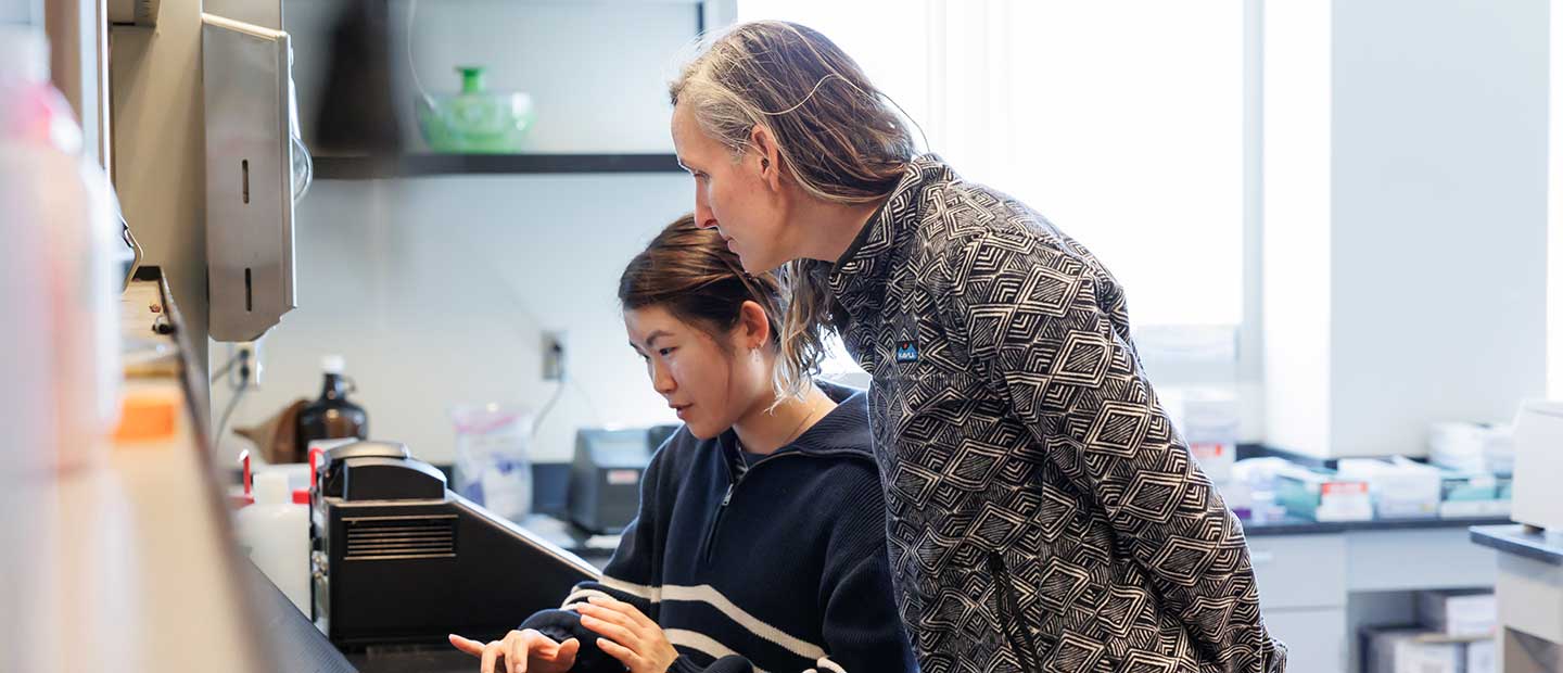 Faculty and student in data lab