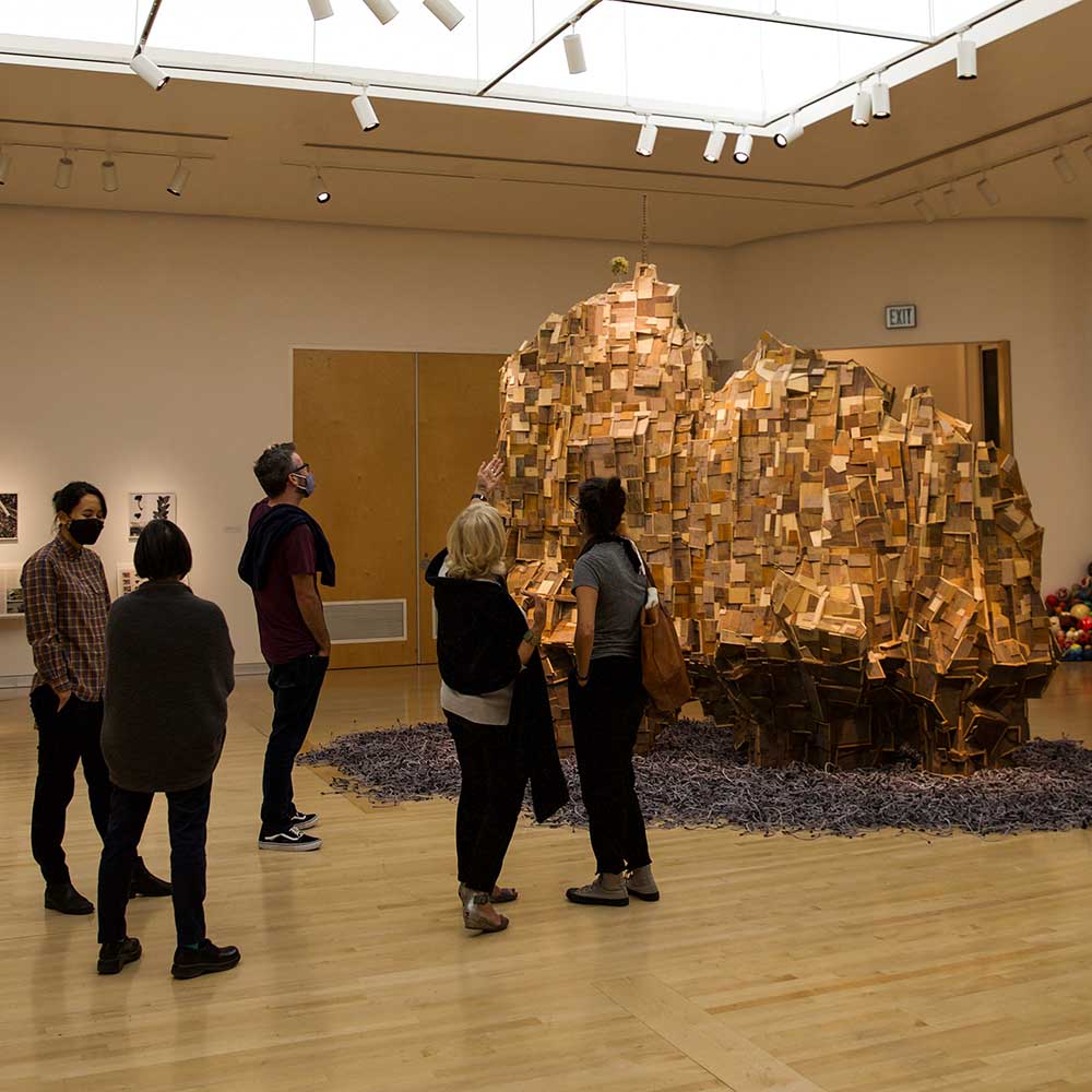 An audience views the LA Edge exhibition at Scripps College's Ruth Chandler Williamson Gallery