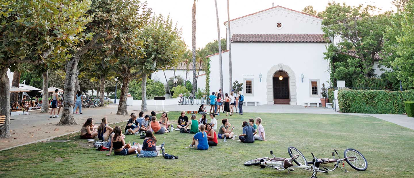 Students hanging out on Scripps lawn in front of Malott Dining Hall and Balch Auditorium.